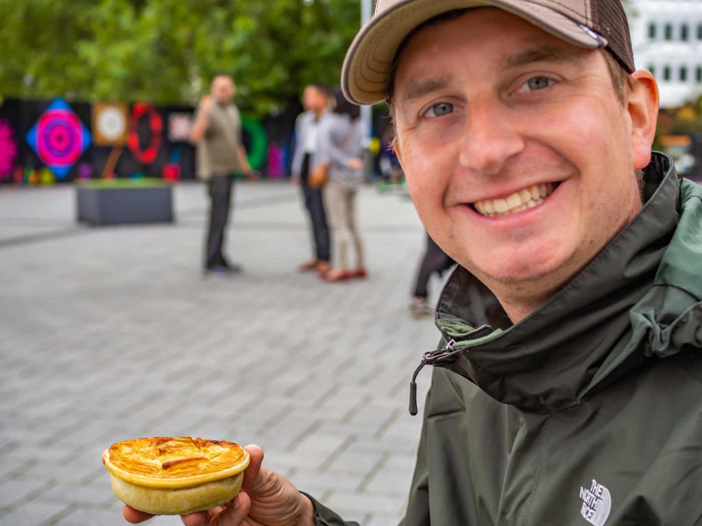 Eating a minced meat pie in New Zealand