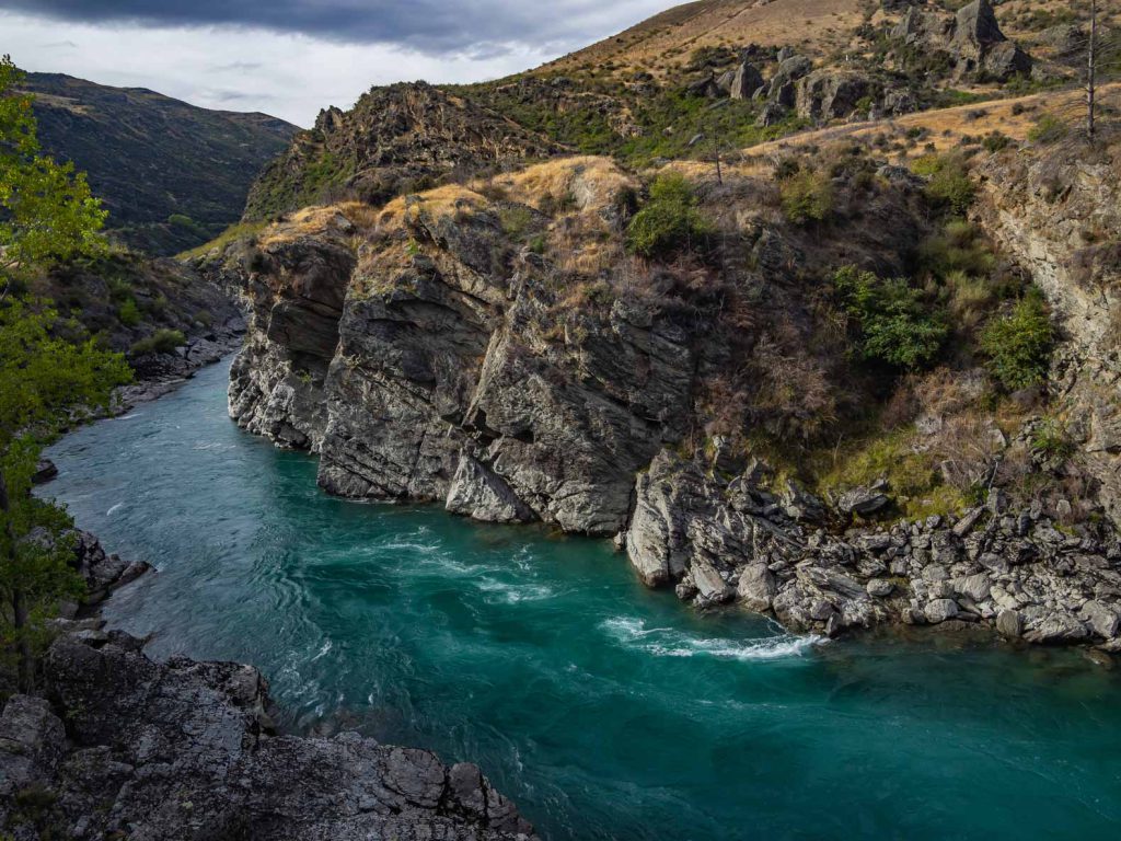 The Kawarau River is a beautiful blue river that snakes through Otago in New Zealand. The river provides beautiful scenery and some great opportunities to take pictures of New Zealand.