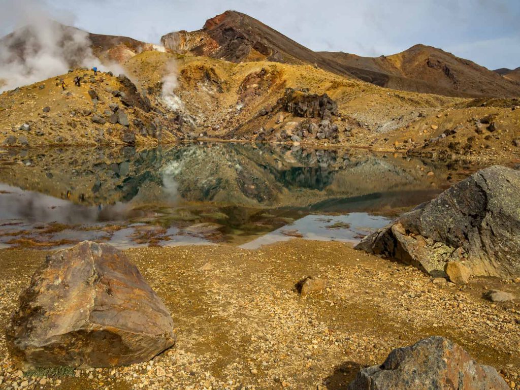 At the top of the Tongariro Alpine Crossing: our favorite New Zealand North Island Hike