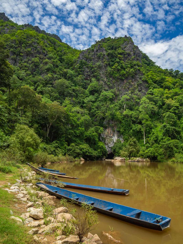 Boats waiting at the entrance of Kong Lor cave