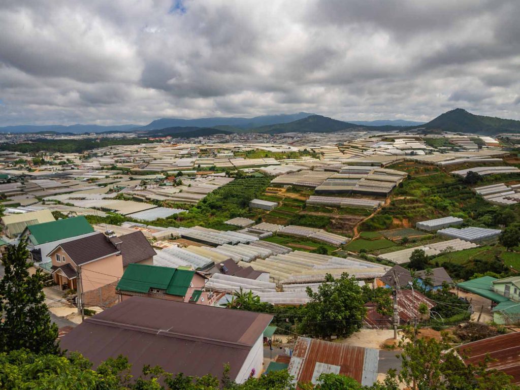 View over the flower greenhouses of Dalat on our Easy rider tour