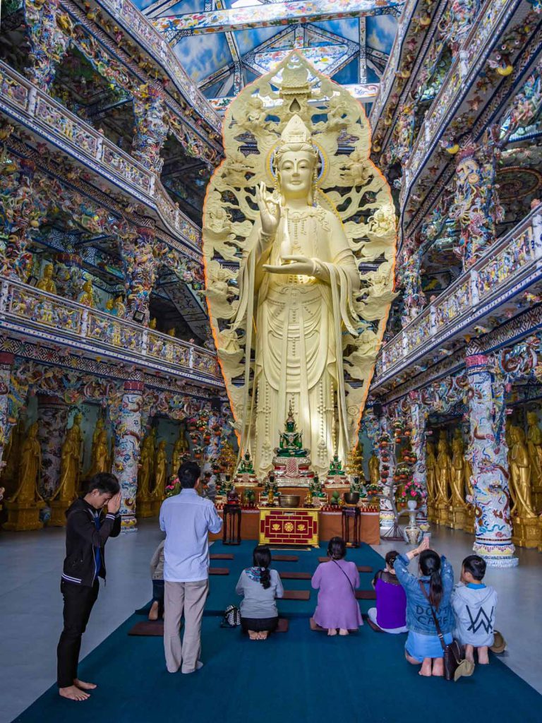 Large golden statue inside Linh Phuoc Pagoda near Dalat, Vietnam