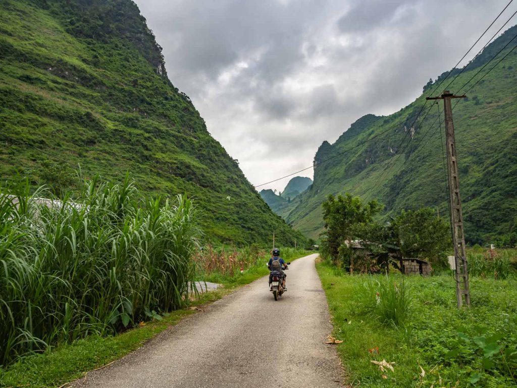 Driving through the valley during the Ha Giang Loop