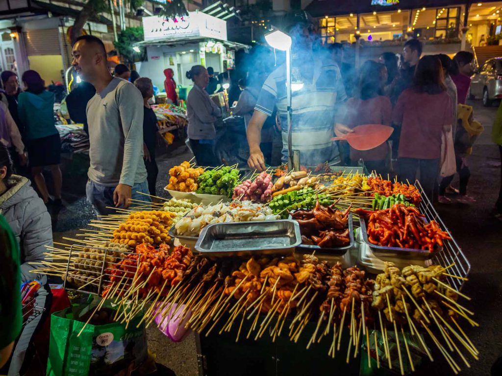 Street vendor with all types of meat on a stick in Dalat, Vietnam